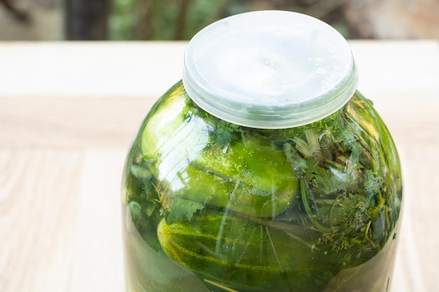 A jar of freshly cooked pickles close up
