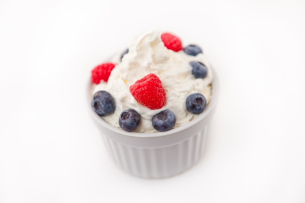 Jar of fruits and whipped cream