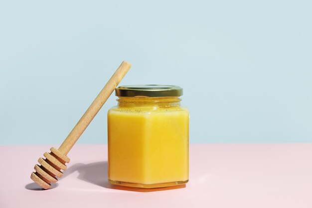 Jar of honey and honey dipper