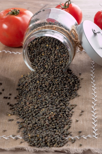 Jar of lentils spilled on the table