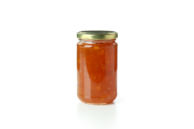 Jar of peach jam isolated on white background