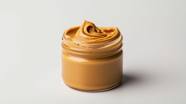 Jar of peanut butter on a white background