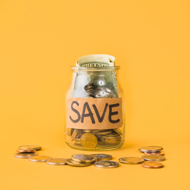 Photo jar for savings on orange background