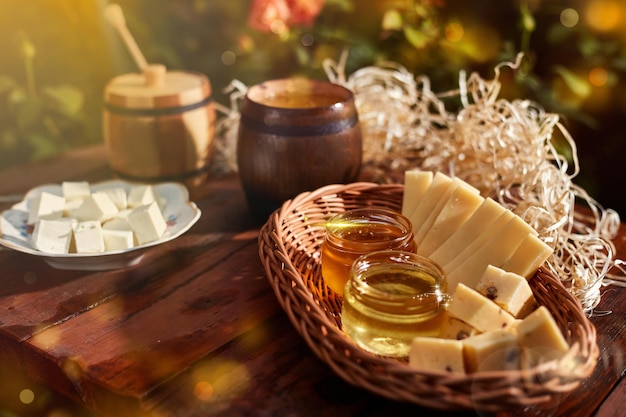 A jar of sweet honey with cheese and rosesfood