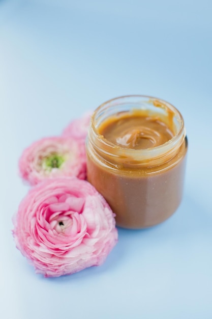 Photo jar with caramel and pink flowers