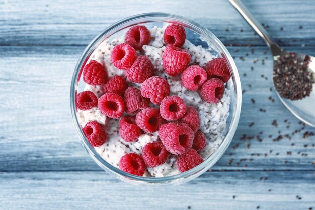 Jar with delicious chia seed pudding on table