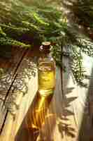 Photo jar with essential oil extract of horsetail oil on a wooden background