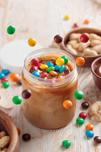 Jar with peanut butter and sweet ingredients