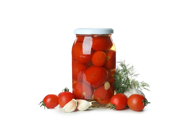 Jar with pickled tomatoes on white