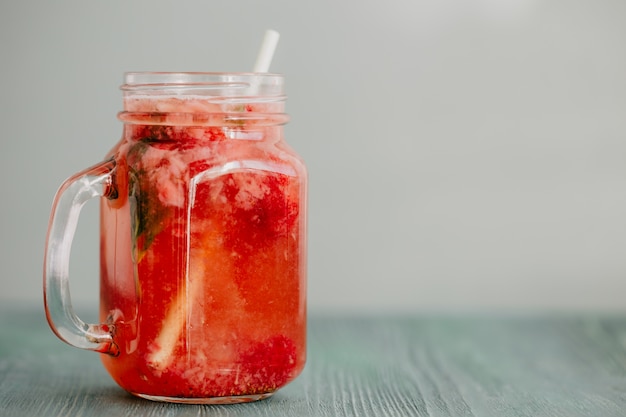 Jar with red smoothie