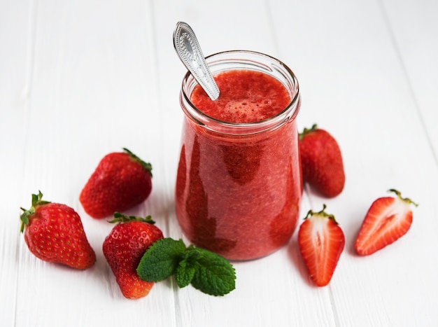 Jar with strawberry smoothie