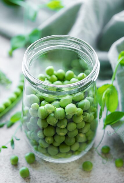 Jar with sweet pea pods