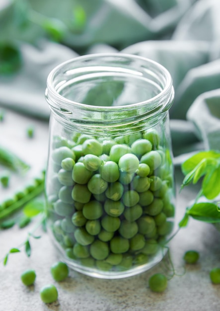 Jar with sweet pea pods