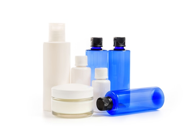 Photo jars, bottles and tubes for cosmetics of different colors and sizes isolated