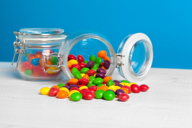 jars with sweet candies on table