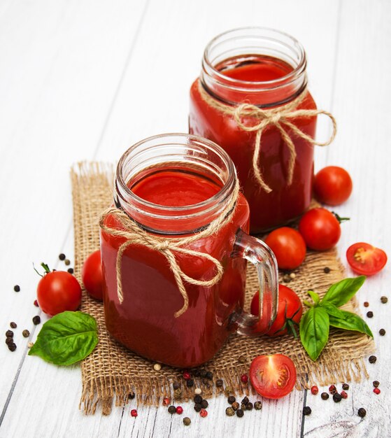 Jars with tomato juice
