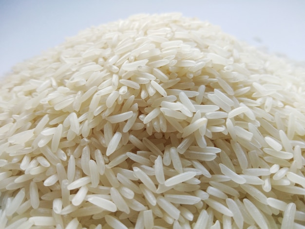 Jasmine rice on white background, close up