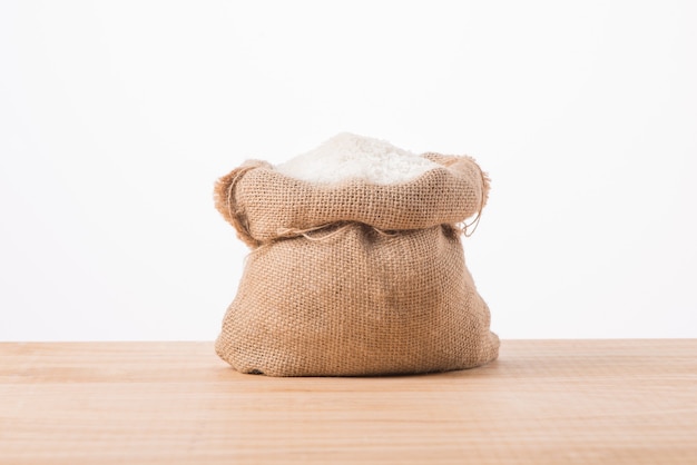 Jasmine white rice in sack isolated on white background