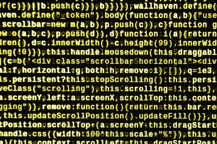 Photo javascript code in text editor. coding cyberspace concept. screen of web developing code