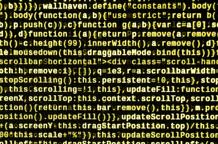 Photo javascript code in text editor. coding cyberspace concept. screen of web developing code