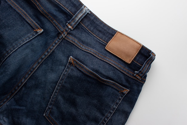 Джинсы background.Texture синего джинса, джинсовой ткани
