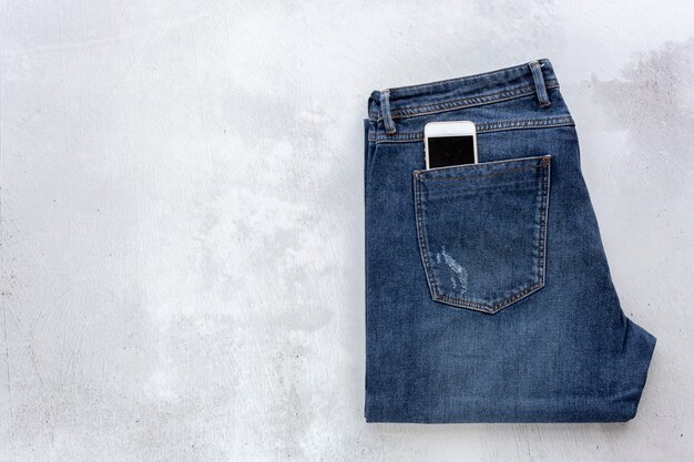 Jeans op concrete hoogste mening als achtergrond