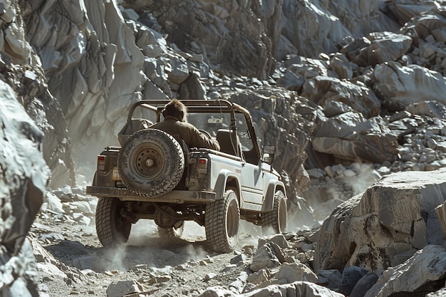 A jeep is driving down a rocky road