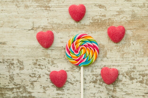 Jelly beans hearts with a colorful lollipop 