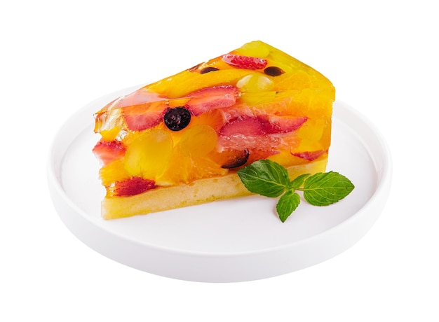 Jelly cake with fruit on white plate