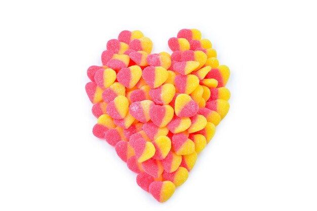 Jelly colorful sweets made into heart shape isolated on white