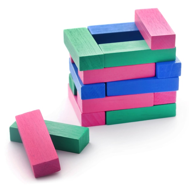 Jenga building of colorful wooden blocks