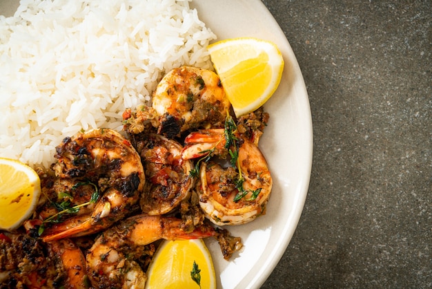 jerk shrimps or grilled shrimps in Jamaica style with lemon and rice