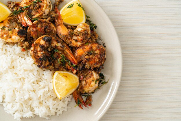 jerk shrimps or grilled shrimps in Jamaica style with lemon and rice