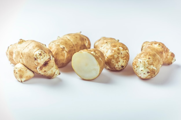 Jerusalem artichoke root on a white background.