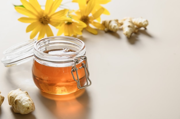 Jerusalem artichoke syrup in bottle flowers and root