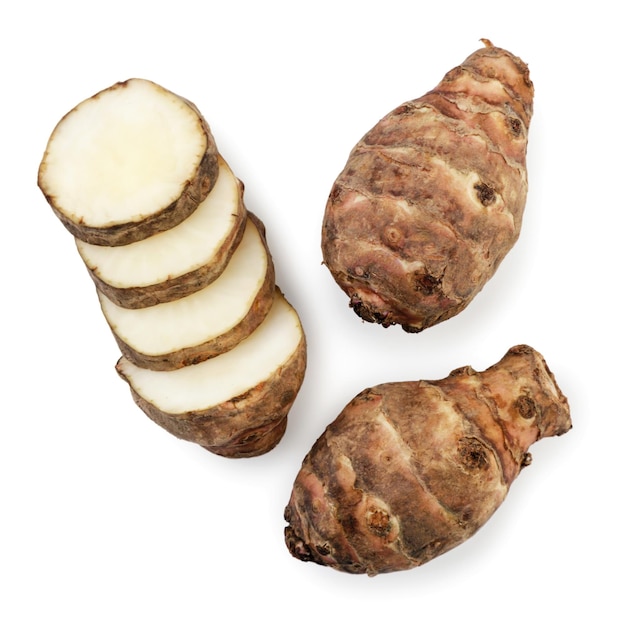 Jerusalem artichoke whole and slices on a white background isolated Top view