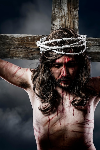 jesus christ with crown of thorns white on the cross of calvary representation