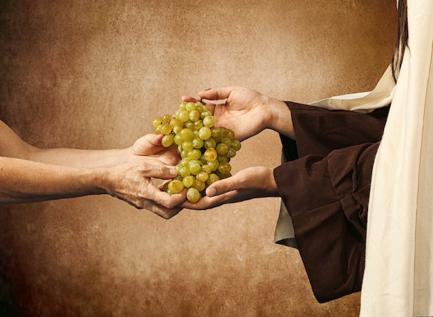 Jesus gives grapes to a beggar