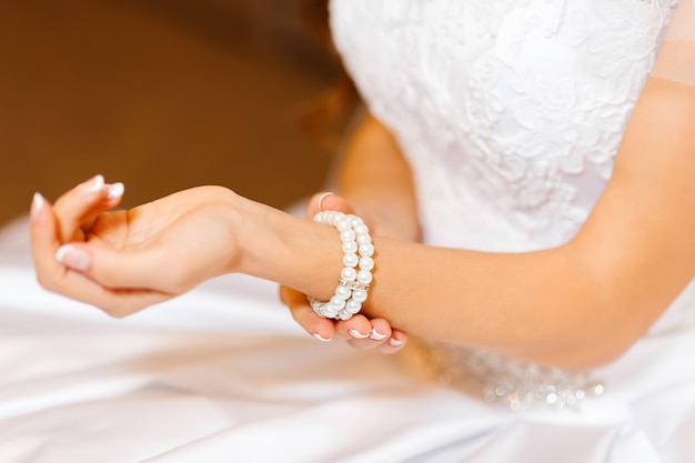 Jeweler bracelet on the bride's hand