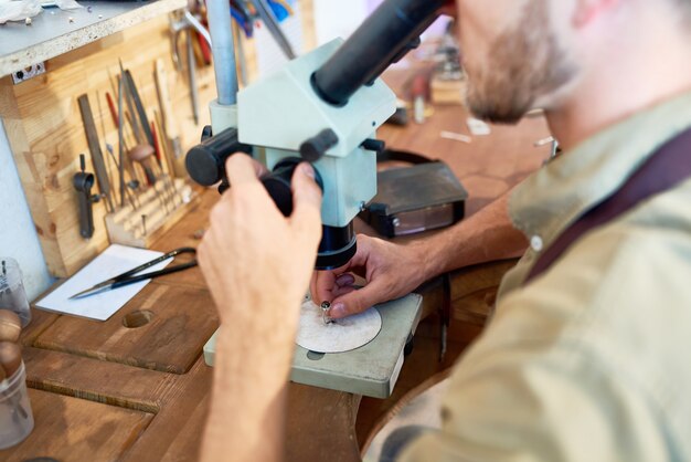 Jeweler Examining Ring