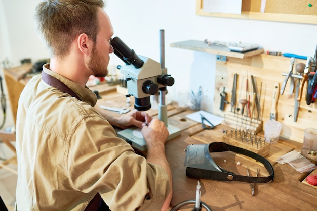 Jeweler Inspecting Stones