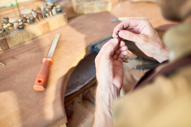 Jeweler Making Silver Decoration