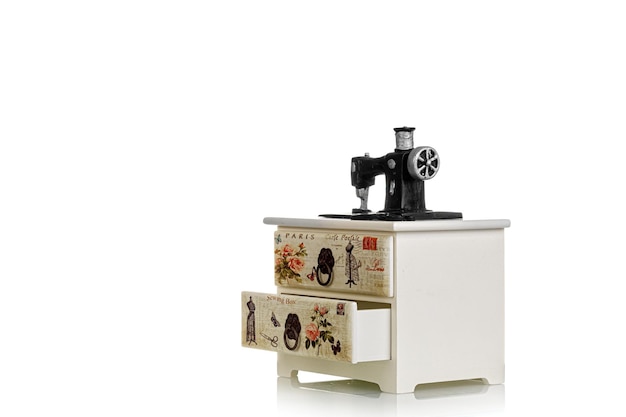 Jewelry box with decorative sewing machine on a white background