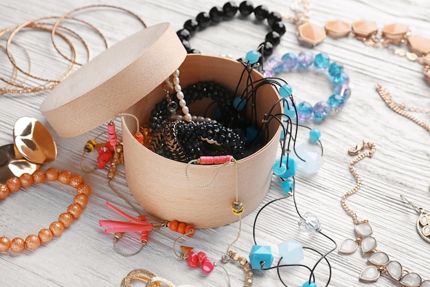 Jewelry and box on wooden table