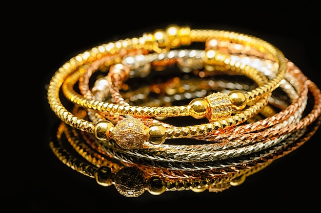 Jewelry and bracelets on black background