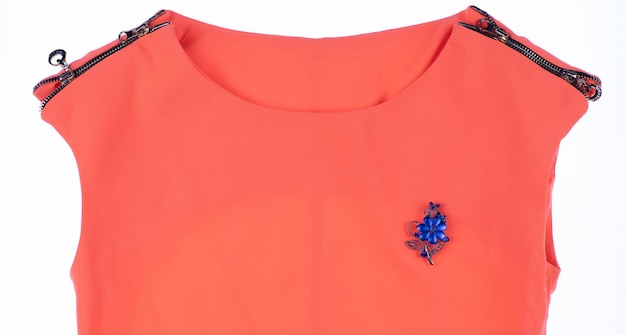 jewelry brooch on an orange dress