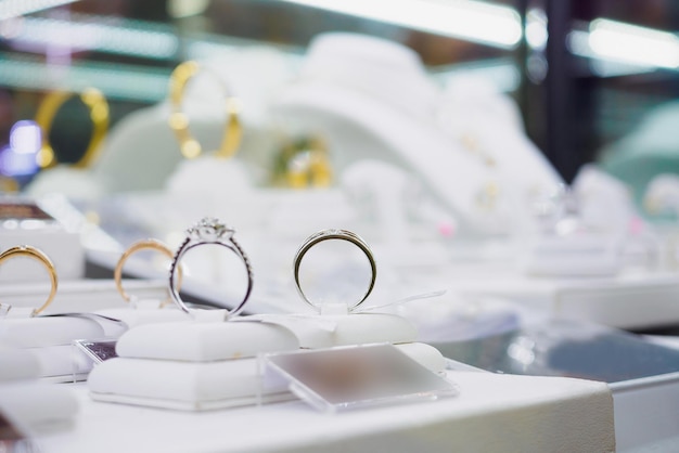 Jewelry diamond rings and necklaces show in luxury retail store window display showcase