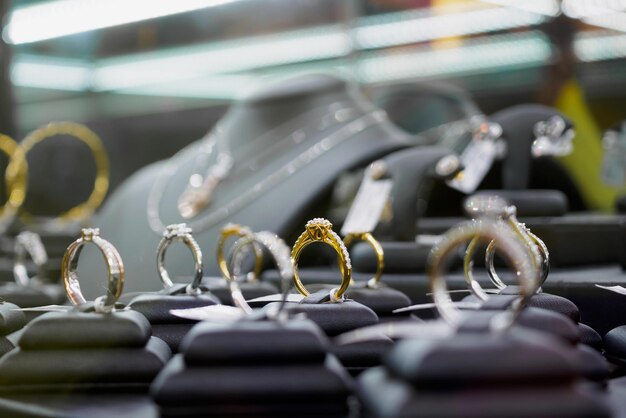 Jewelry diamond rings and necklaces show in luxury retail store window display showcase