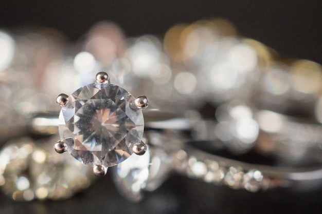 Jewelry diamond rings set on black background close up