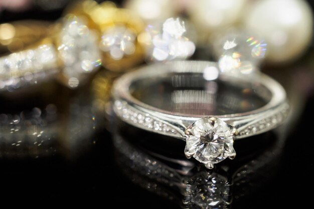 Jewelry diamond rings with reflection on black background